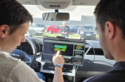 Researchers Gerard de Mas and Adrià Subirana inside the car